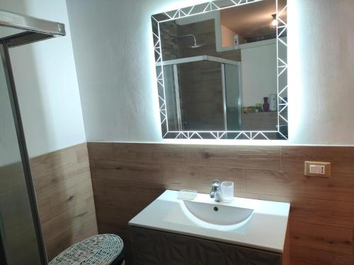 a bathroom with a sink and a mirror at La casa di Piera e Gina in Perugia
