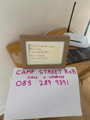 a picture of a camp street bat sign on a desk at Room 1 Camp Street B&B in Oughterard