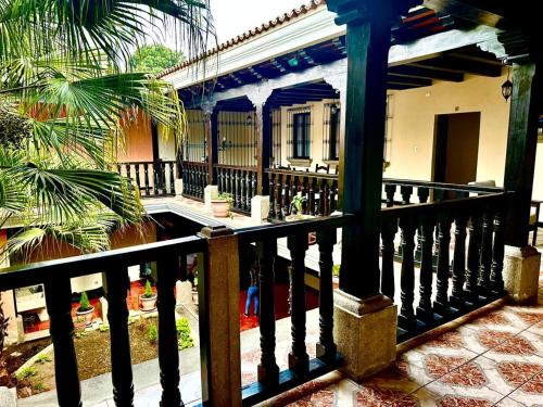 a balcony of a house with a fence at Real Marquez Hotel in Antigua Guatemala