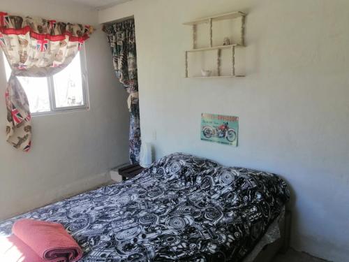 Giường trong phòng chung tại Posada "Villa Biker"