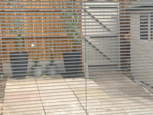 a room with two potted plants on a wooden floor at Greens Walk in Liverpool