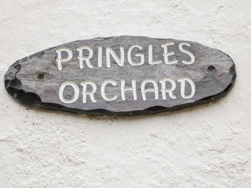 a sign on a wall that reads principles orchard at Pringles Orchard in Gildingwells
