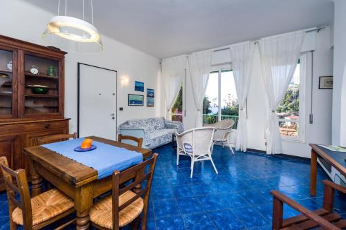 a kitchen and living room with a table and chairs at Monterosso Apartments in Servano's Villas in Monterosso al Mare