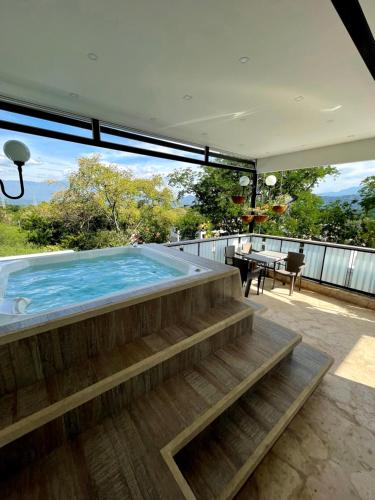 a swimming pool on the roof of a house at Apartamento duplex exclusivo- Linda Sofia Belle in Santa Fe de Antioquia