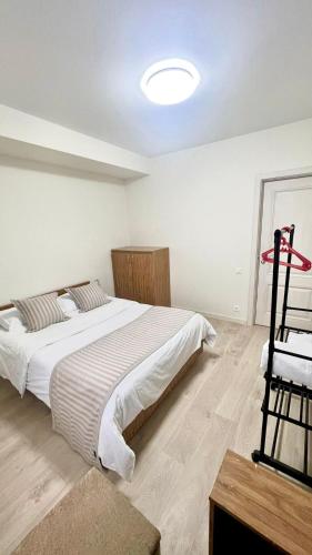 a bedroom with a large bed in a room at La Casa de Armenie in Yerevan