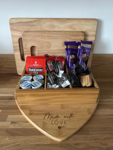 a wooden box sitting on a wooden floor with food at Rosy Bay Cottage in Scarborough