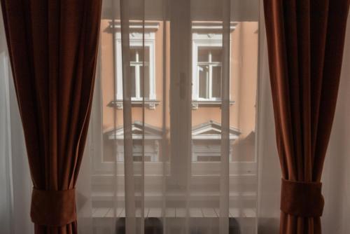 Ένα ή περισσότερα κρεβάτια σε δωμάτιο στο Apartments Artee Free Garage Parking