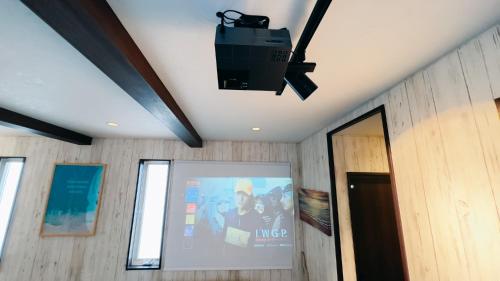 a television on the ceiling of a room at Ocean Villa Vihara ヴィハーラ in Ōda