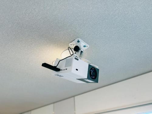 a security camera is hanging from a ceiling at Ocean Villa Vihara ヴィハーラ in Ōda