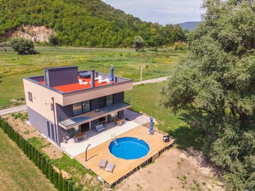 an aerial view of a house with a swimming pool at Lohovo Villa Bukva in Otoka