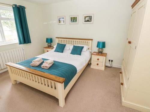 Postel nebo postele na pokoji v ubytování 4 Hanbury Lodge