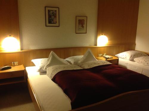 Postel nebo postele na pokoji v ubytování Hotel Garni Lichtenau