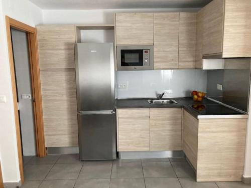 A kitchen or kitchenette at Fantástico apartamento en Triana