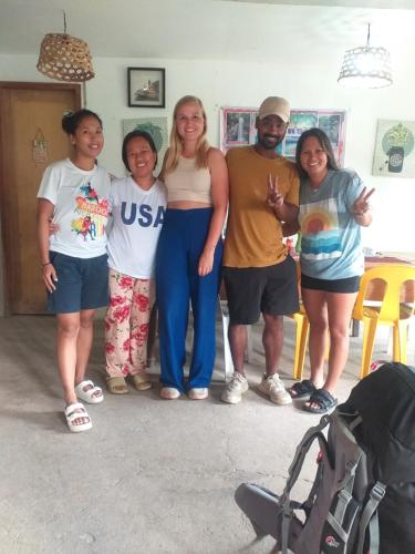 a group of people posing for a picture at Paraiso Hostel Moalboal in Moalboal