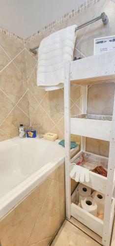 a bathroom with a bunk bed and a bath tub at The Tipsy Expat in Paarl