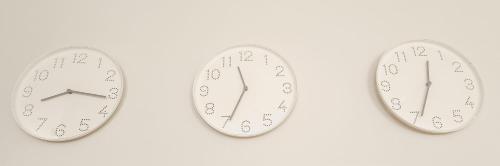 a pair of clocks on a white background at The Tipsy Expat in Paarl