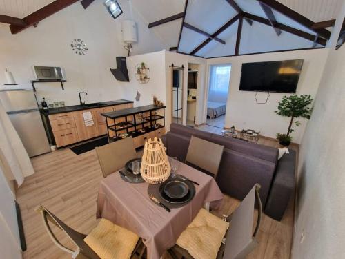 an overhead view of a living room with a table and chairs at Bella vista house 971 in Le Gosier