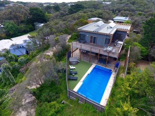 an aerial view of a house with a swimming pool at Moonah on Forbes in Rye