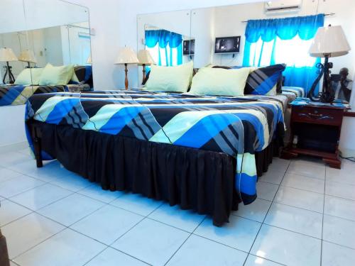 Krevet ili kreveti u jedinici u okviru objekta Secure Gated1BR Home in Caribbean Estate