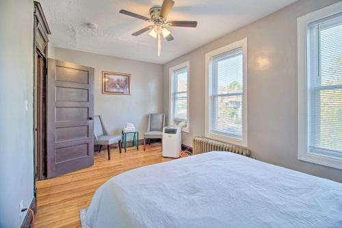 a bedroom with a bed and a ceiling fan at 4BR+Parking central townhouse walk to metro&shops in Washington, D.C.