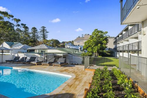 a swimming pool in the backyard of a house at Kiama Shores in Kiama