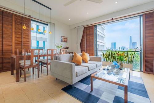 a living room with a couch and a table at Park view Avalon Apartment District 1 HCM City in Ho Chi Minh City