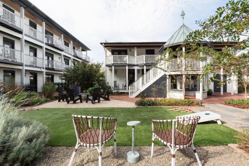 a courtyard with two chairs and a gazebo at ARRIVE Wilmington in Wilmington