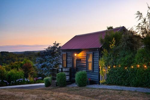 a tiny house with christmas lights on it at The Nook in Daylesford