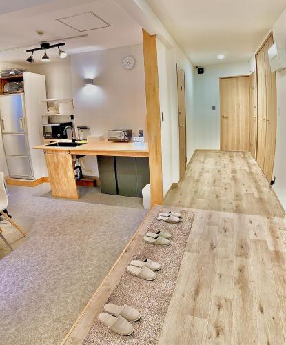 a room with two pairs of sandals on the floor at CABIN Nozawaonsen in Nozawa Onsen