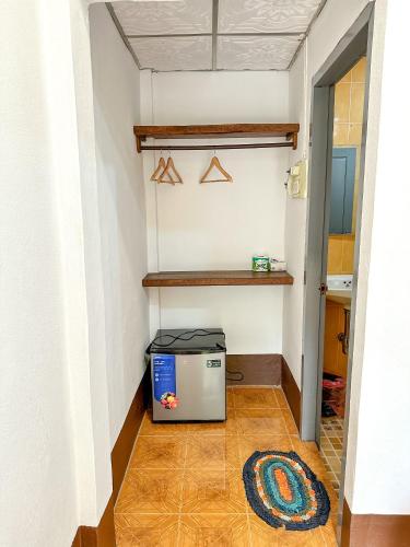 a hallway with a refrigerator in a room at Chaliya Boutique Garden in Luang Prabang