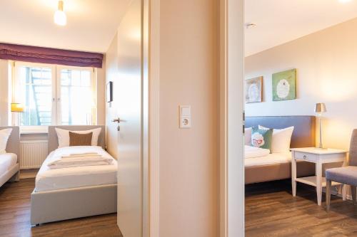 Postel nebo postele na pokoji v ubytování Strand Residenz Amrum Strandhaus 6
