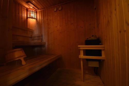 a small wooden room with a bench and a window at BoonRumpa Accommodation in Bangkok