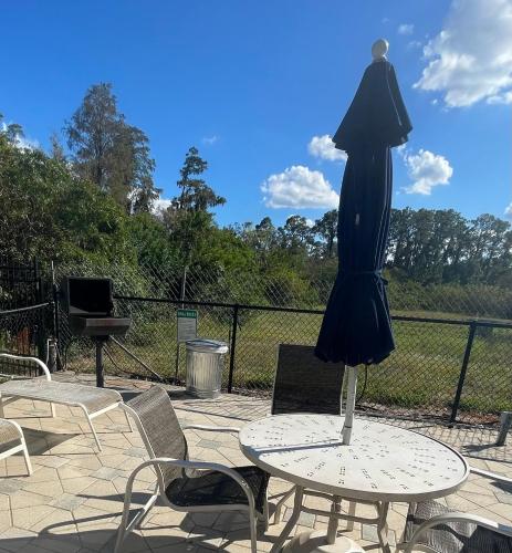 a dress is sitting on a table on top of a table at Disney 1 mile , Blue Heron 1 room 2 bath,amenities,6 guests, walk to restaurants, no fees at check in in Orlando