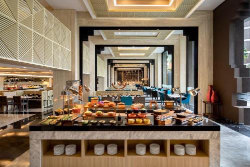 a hotel lobby with a buffet of food on display at Aston Sentul Lake Resort & Conference Center in Bogor