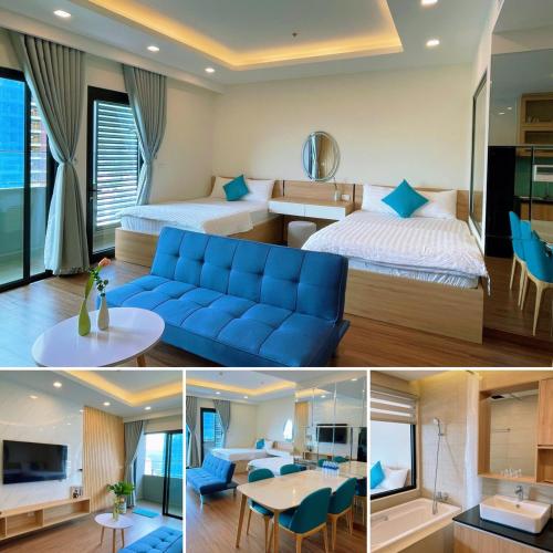 a hotel room with a blue couch and a bed at Tony Apartment -FLC Sea Tower Quy Nhon in Quy Nhon