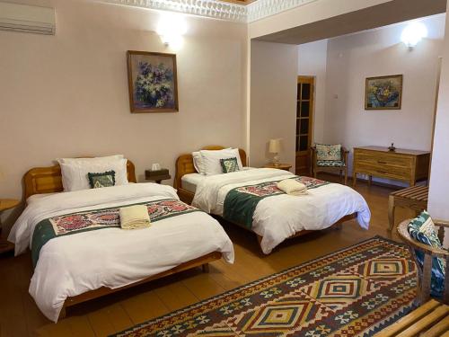 Postel nebo postele na pokoji v ubytování Salom Inn