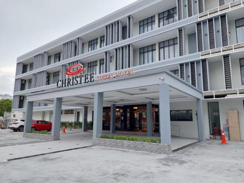 a building with a sign on the front of it at CHRISTEE SUITES HOTEL in Melaka