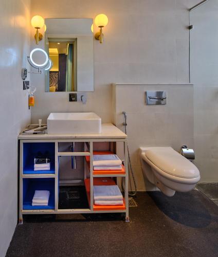 a bathroom with a sink and a toilet at Zone Connect by The Park Port Blair in Port Blair