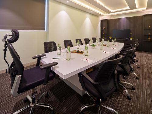 a conference room with a long table and chairs at Zone Connect by The Park Port Blair in Port Blair