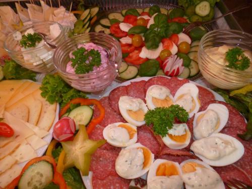 a bunch of different types of food on a table at Pension Villa Else in Heidenau