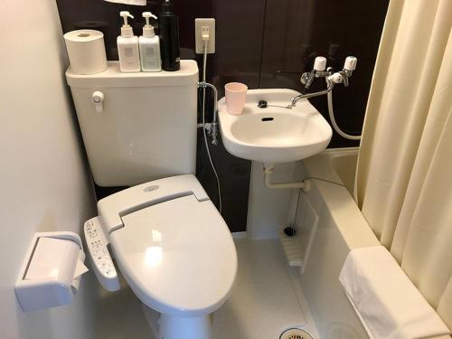 a small bathroom with a toilet and a sink at Life is Beautiful - Vacation STAY 94973 in Hachimantai