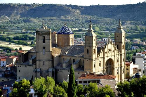 a large building with towers on top of a city at Parador de Alcañiz in Alcañiz