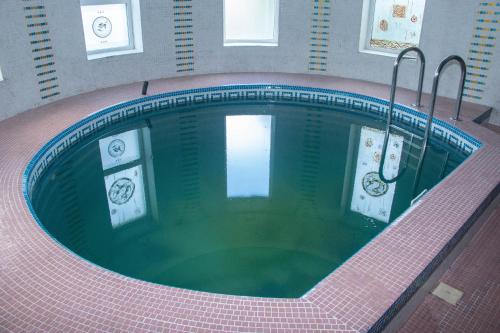 an overhead view of a pool of water in a building at ezio in Chişinău