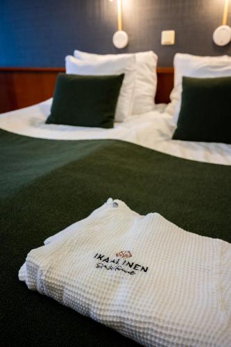 Ένα ή περισσότερα κρεβάτια σε δωμάτιο στο Ikaalinen SPA & Resort