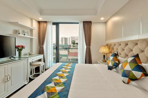 Ένα ή περισσότερα κρεβάτια σε δωμάτιο στο Branda Apartment & Hotel