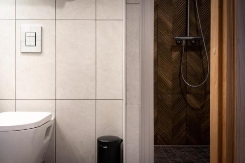 a bathroom with a shower and a toilet in it at Espak Hostel in Tallinn