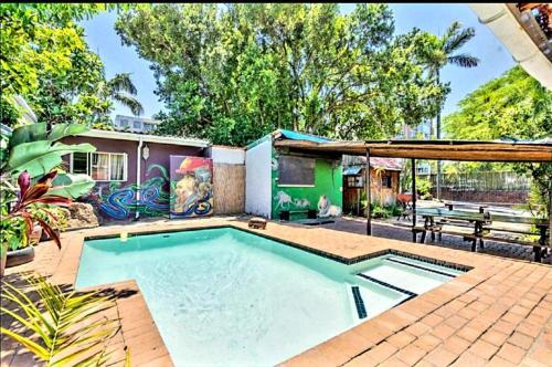 a house with a swimming pool in a yard at Tekweni in Durban