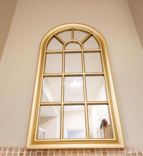 an arched window in a room at The Lazy Expat in Paarl