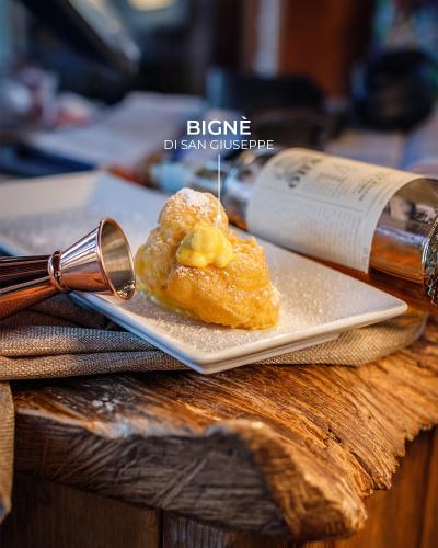 a plate with a piece of food on a table at LA PIANETTA case vacanze in Palidoro
