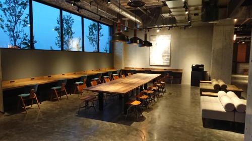 a large conference room with a long table and chairs at Kawasaki King Skyfront Tokyu REI Hotel in Kawasaki